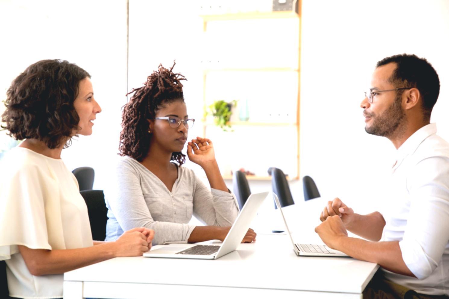 Financial data analysis workspace showing budget trend charts and spreadsheet reviews