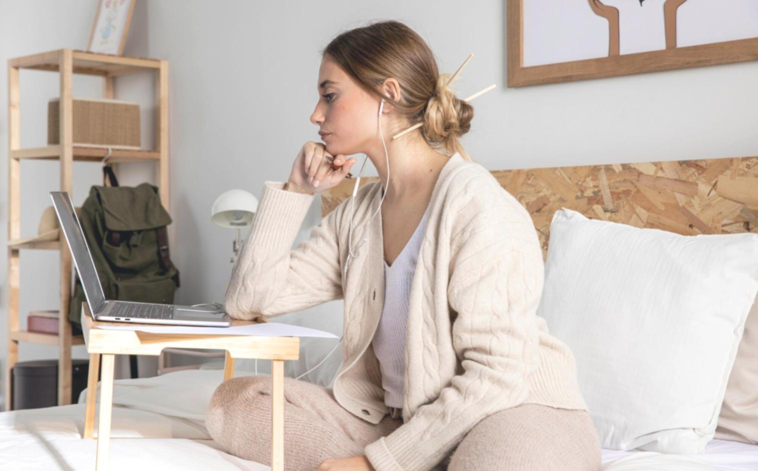 Student reviewing monthly expense tracking results on laptop